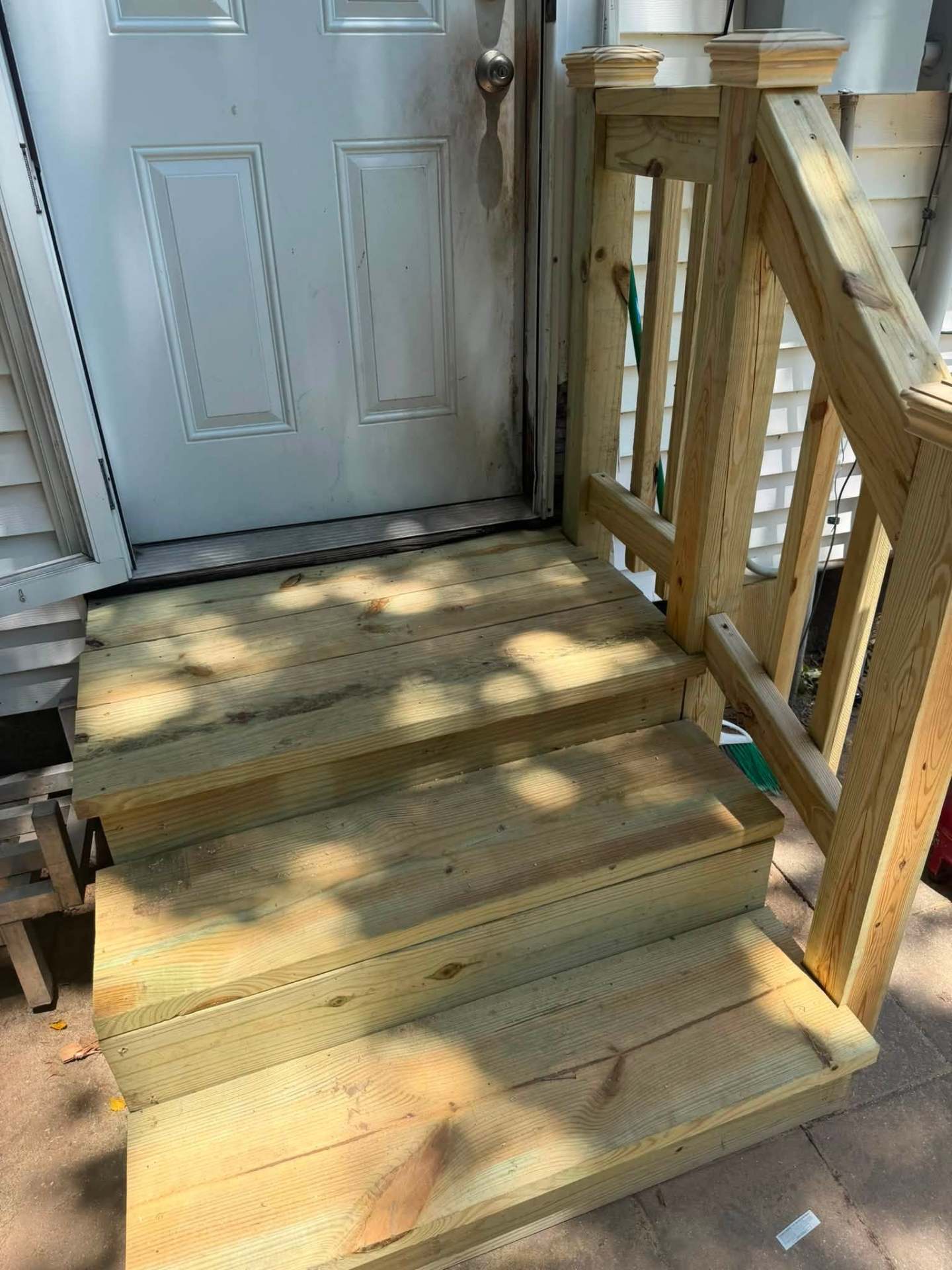 Completed exterior porch and entry rebuild by Red River Renovations